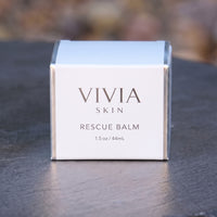 VIVIASKIN Rescue Balm box on a slate surface