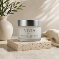Vivian Skin Intensive Body Cream jar on a stone surface with a neutral background